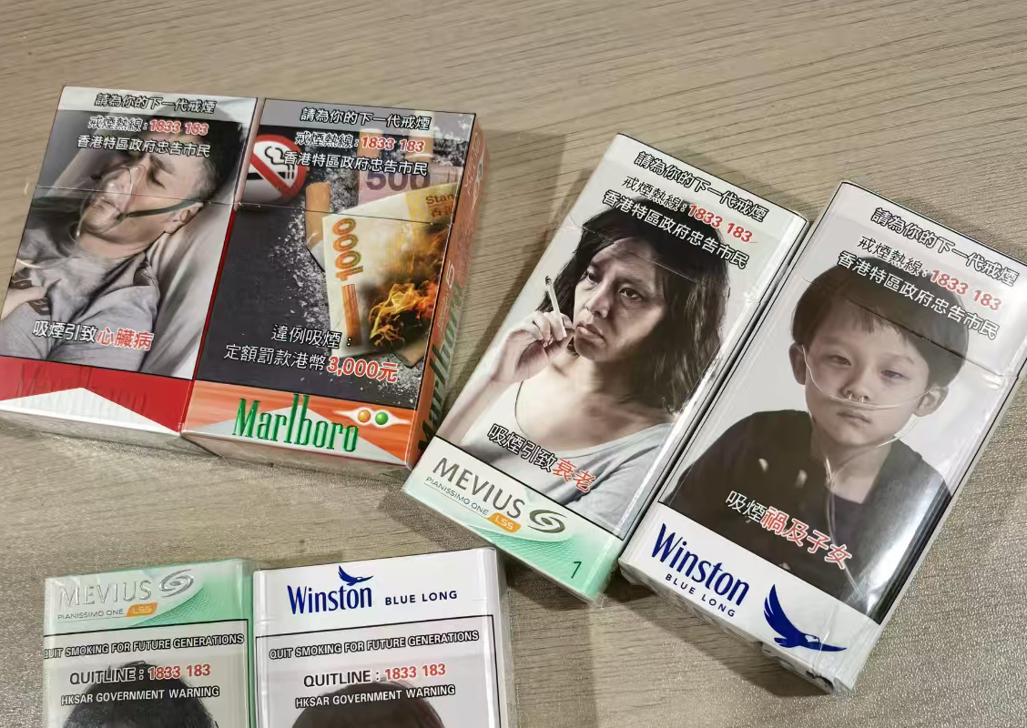 香港要把烟盒变成“暗啡色病历本”，内地网友喊跟进，可为什么我们连张警示图都印不上？